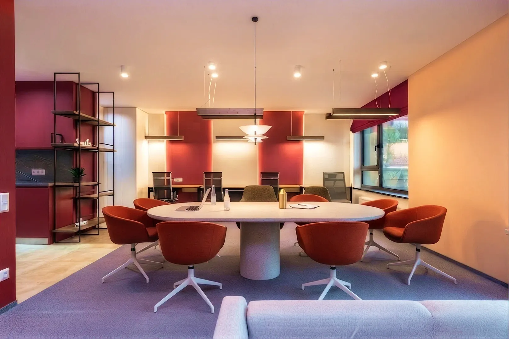 Cbayt office meeting room with orange chairs around a conference table